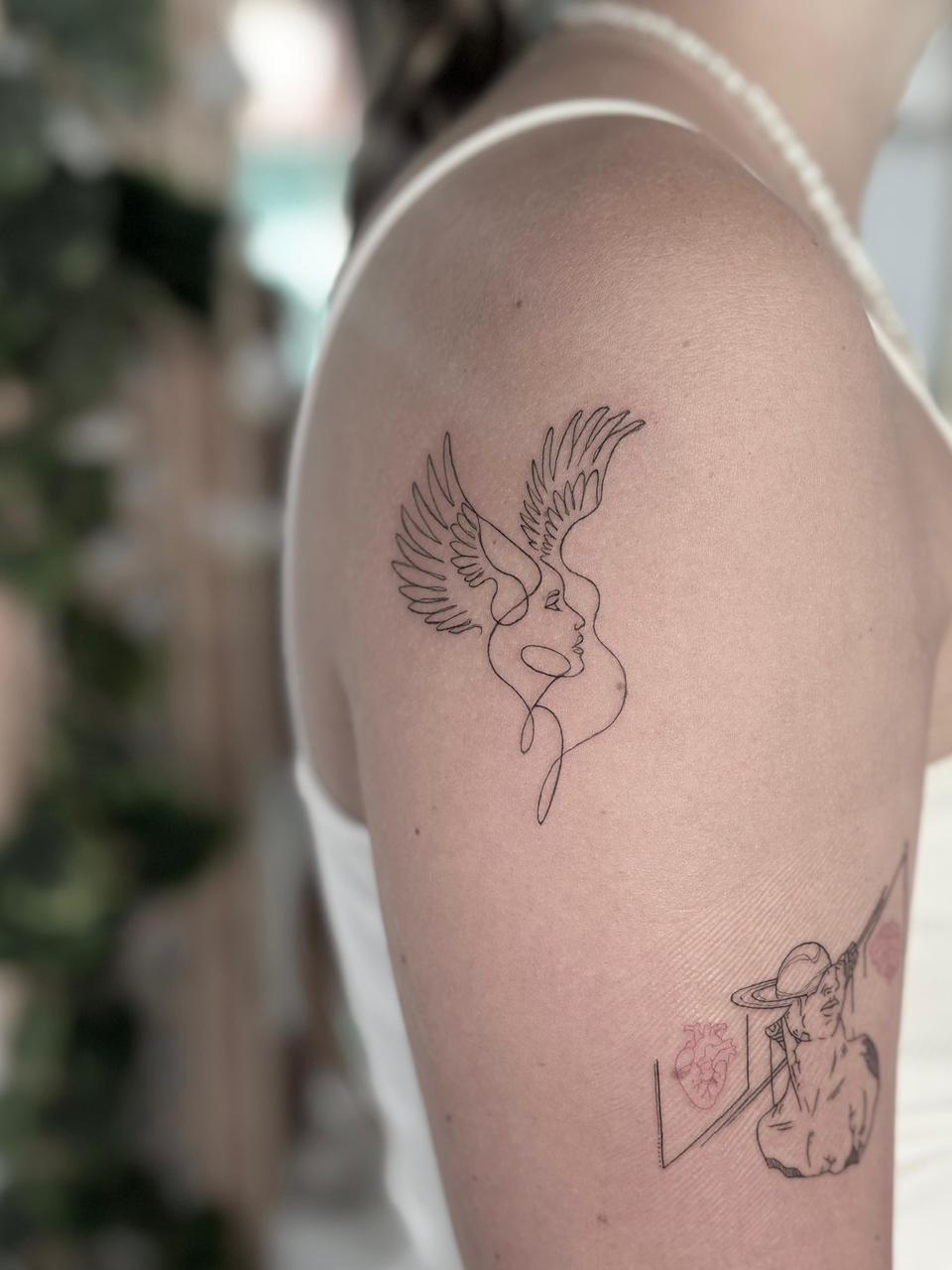 Single needle wing and face artwork - Tropical Ink Bali
